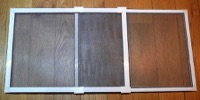 Flyscreens for sash windows that expand into the gap