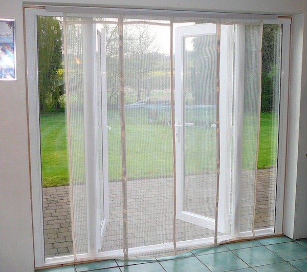 Magnetic fly screen shop door