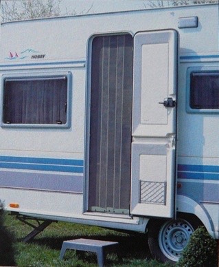 Caravan with a fitted flyscreen to the doorway