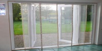 Large magnetic screen that self closes over a patio and french door 