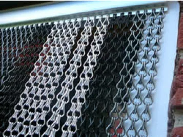Chain fly screen door hung in doorway